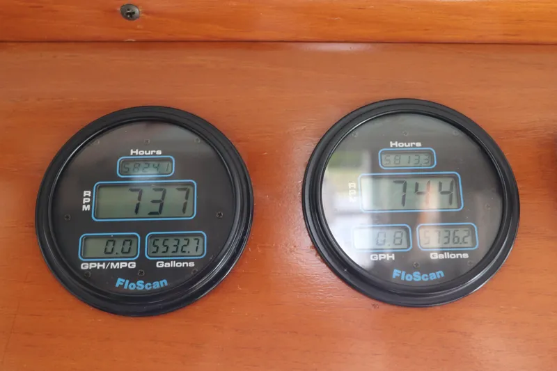 Sea Cow Yacht Photos Pics FloScan gauges on 2005 DeFever 49 Cockpit Motor Yacht dashboard displaying RPM and fuel data.