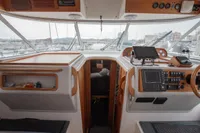 Interior view of 2005 Nimbus 380 Commander yacht cockpit with navigation equipment.