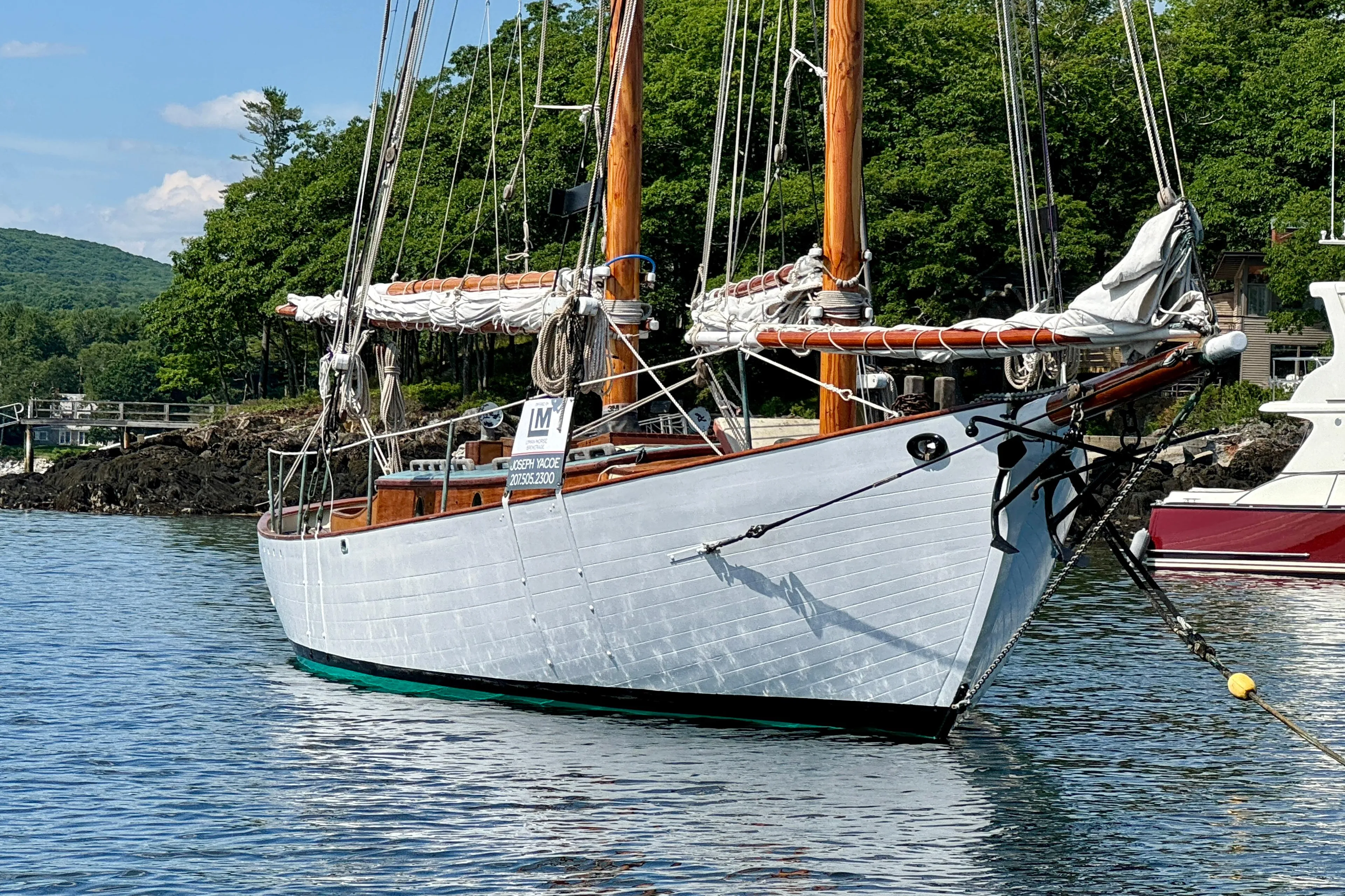 Sailing yacht "John Alden Malabar II" anchored in scenic waters, 1996 model.