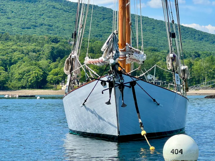 Alyria Yacht Photos Pics Front view of 1996 Custom John Alden Malabar II sailboat on calm water.
