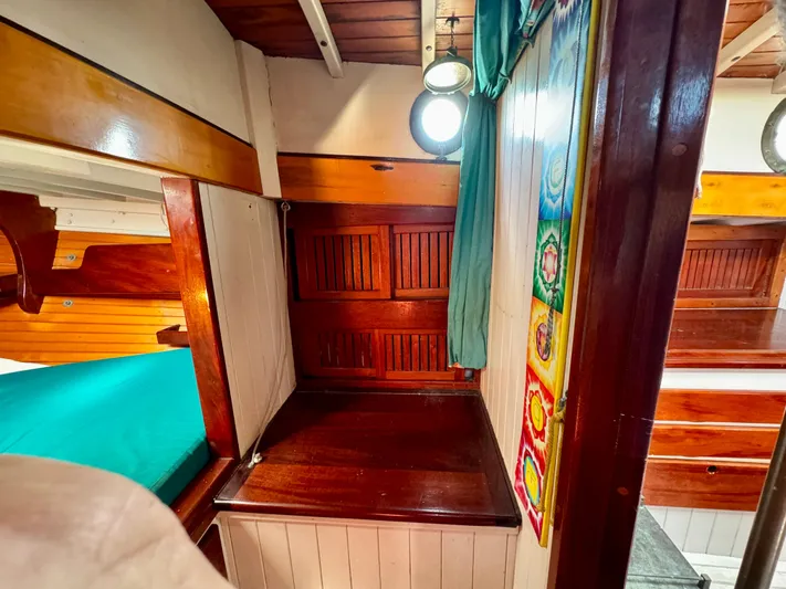 Alyria Yacht Photos Pics Cozy wooden cabin interior of 1996 Custom John Alden Malabar II sailboat.