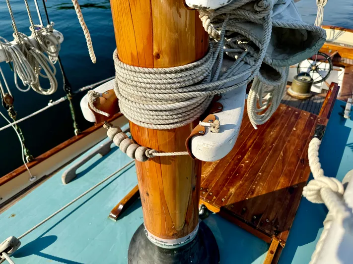 Alyria Yacht Photos Pics Wooden sailboat deck with ropes and mast, Custom John Alden Malabar II, 1996 model.