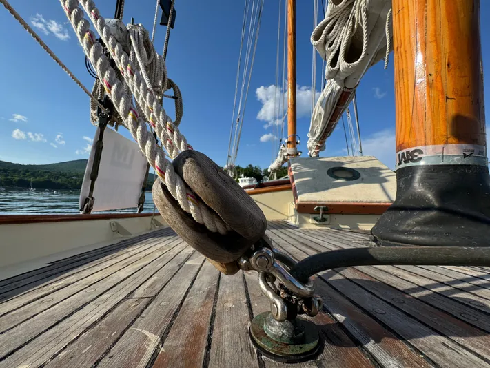 Alyria Yacht Photos Pics Close-up of rigging on 1996 Custom John Alden Malabar II sailboat, with clear blue sky.