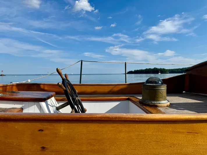 Alyria Yacht Photos Pics Wooden deck of 1996 Custom John Alden Malabar II sailboat with scenic ocean view.