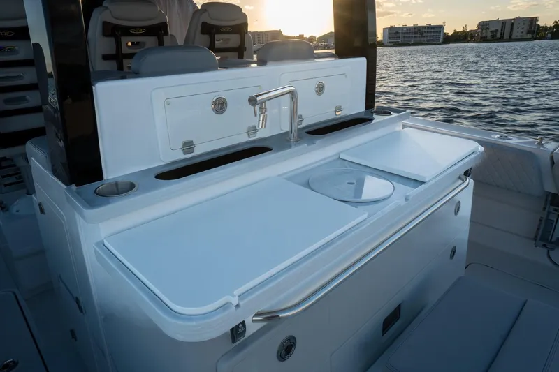  Yacht Photos Pics 2024 HCB 42 Lujo boat interior with sleek kitchen setup and water view.
