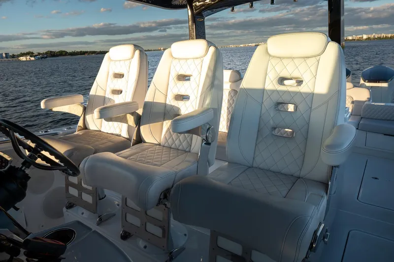  Yacht Photos Pics Luxurious seating on 2024 HCB 42 Lujo boat, featuring elegant white upholstery.