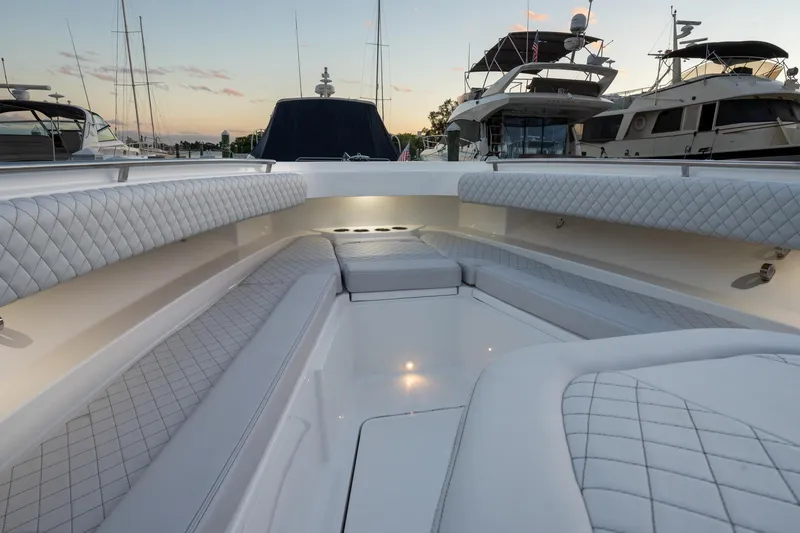  Yacht Photos Pics 2024 HCB 42 Lujo luxury boat interior with quilted seating at sunset.