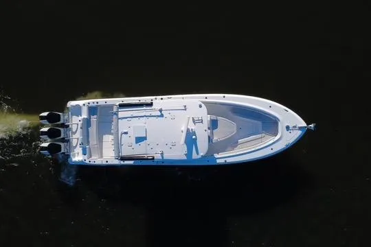  Yacht Photos Pics Aerial view of 2024 HCB 42 Lujo boat cruising on dark water.