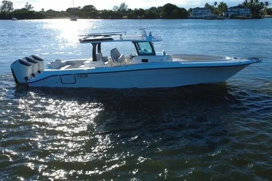  Yacht Photos Pics 2024 HCB 42 Lujo boat on calm water, side view, with three outboard engines.