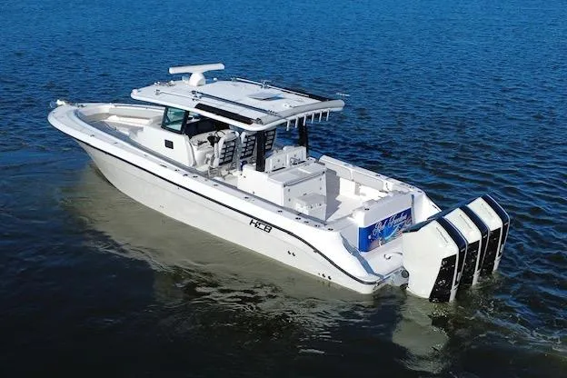  Yacht Photos Pics 2024 HCB 42 Lujo boat cruising on open water, showcasing sleek design and powerful engines.