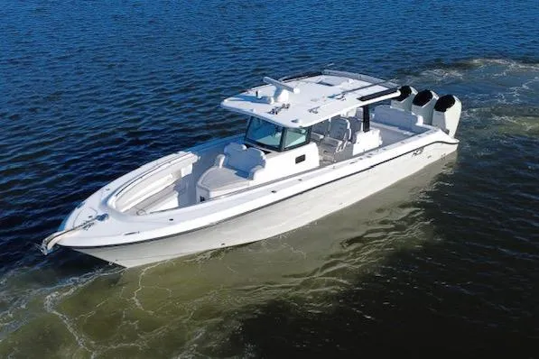  Yacht Photos Pics 2024 HCB 42 Lujo boat cruising on open water, showcasing sleek design and powerful engines.