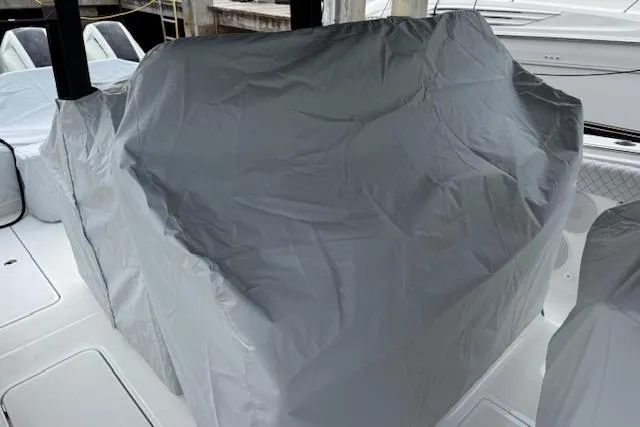  Yacht Photos Pics 2024 HCB 42 Lujo boat covered with a protective tarp on deck.