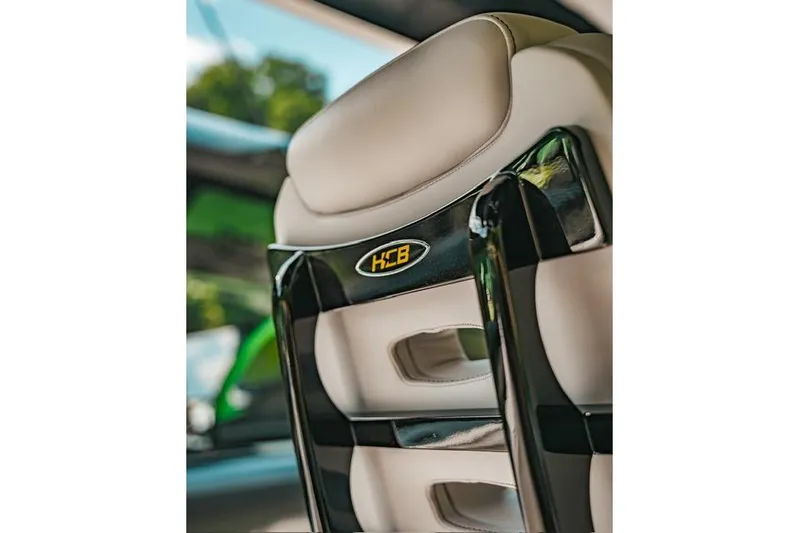  Yacht Photos Pics 2024 HCB 42 Lujo boat seat with logo, featuring sleek black and beige design.