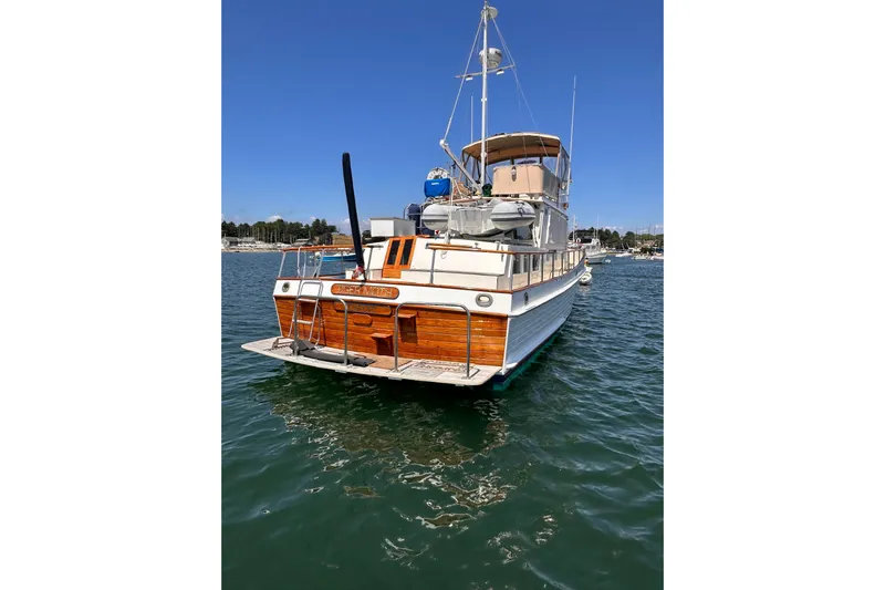 Tiger Moth (reserved) Yacht Photos Pics 1984 Grand Banks 42 Classic yacht on water, showcasing elegant wooden design.