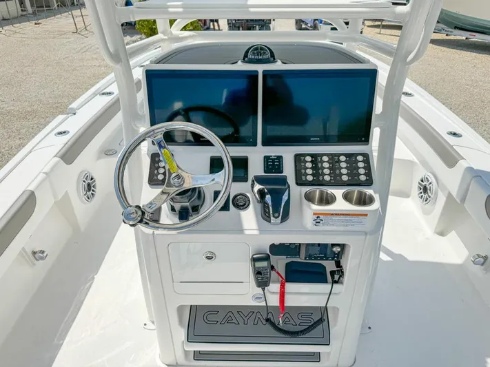  Yacht Photos Pics 2024 Caymas 28 HB boat dashboard with dual screens and steering wheel.