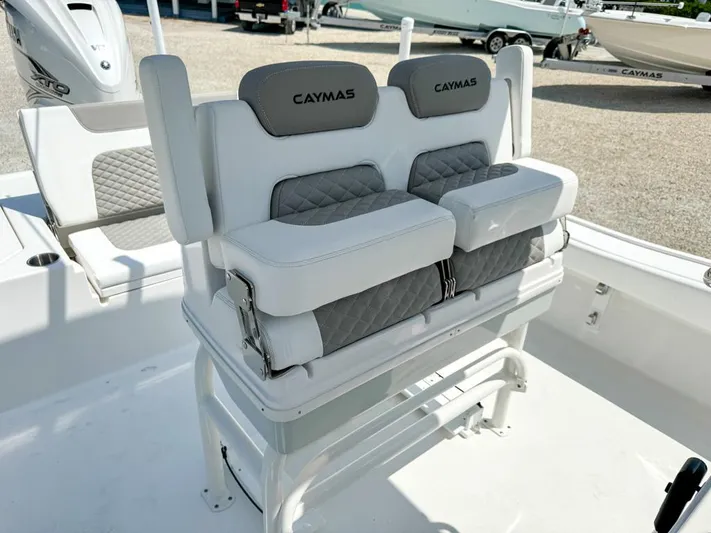  Yacht Photos Pics 2024 Caymas 28 HB boat seating with gray and white cushioned design.