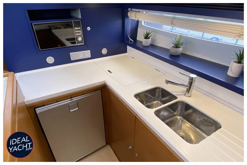 Mary Blue 3 Yacht Photos Pics Modern yacht kitchen with dual sinks, microwave, and potted plants on a Garcia 65ft Aluminium Centerboard.