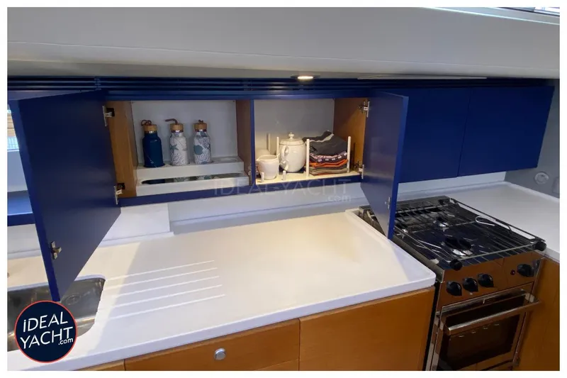 Mary Blue 3 Yacht Photos Pics Modern kitchen in 2008 Garcia 65ft Aluminium Centerboard yacht with blue cabinets and stove.