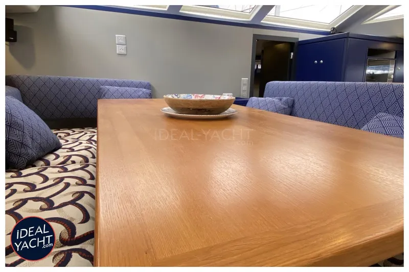 Mary Blue 3 Yacht Photos Pics Interior of 2008 Garcia 65ft Aluminium Centerboard yacht with wooden table and patterned seating.