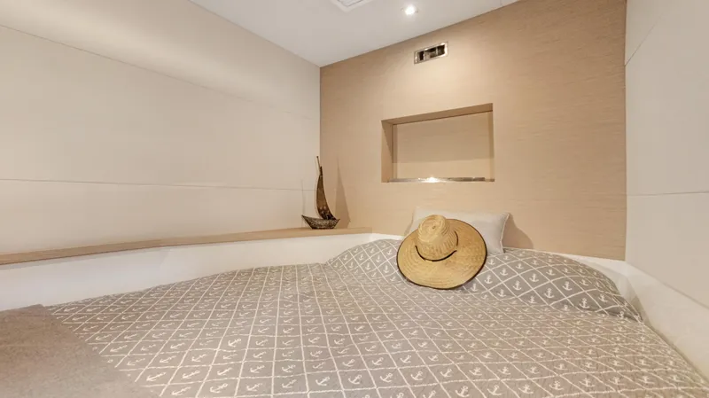 A New Hope Yacht Photos Pics Cozy bedroom in 2018 Fountaine Pajot MY 44 yacht with decorative hat and model ship.