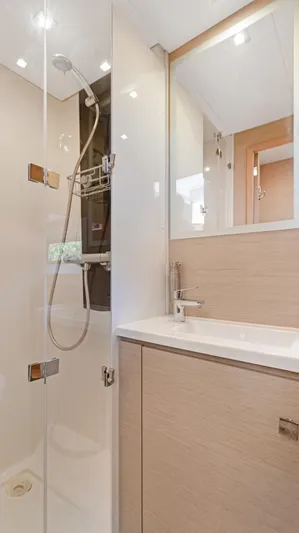 A New Hope Yacht Photos Pics Modern bathroom in 2018 Fountaine Pajot MY 44 yacht with glass shower and sleek fixtures.