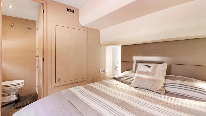 A New Hope Yacht Photos Pics Luxurious bedroom interior of 2018 Fountaine Pajot MY 44 yacht with ensuite bathroom.