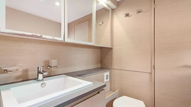 A New Hope Yacht Photos Pics Modern bathroom in 2018 Fountaine Pajot MY 44 yacht with sleek fixtures and mirror cabinets.