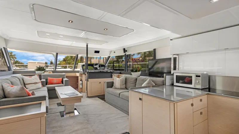 A New Hope Yacht Photos Pics Luxurious interior of 2018 Fountaine Pajot MY 44 yacht with modern furnishings and panoramic windows.