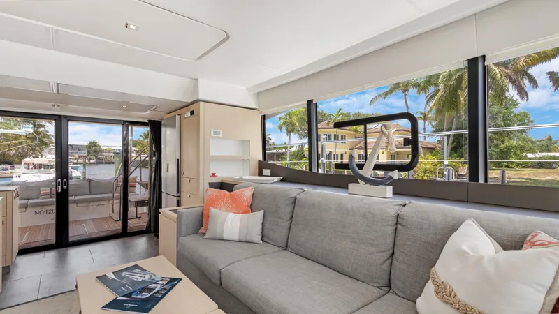 A New Hope Yacht Photos Pics Luxurious interior of 2018 Fountaine Pajot MY 44 yacht with modern decor and large windows.