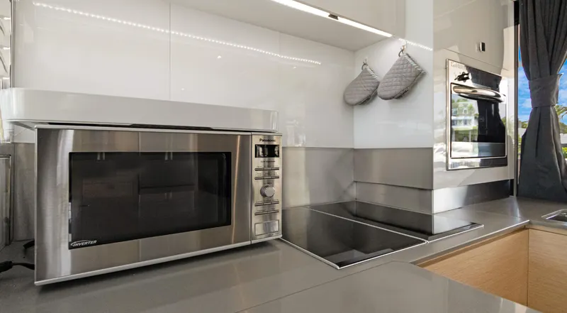 A New Hope Yacht Photos Pics Modern kitchen in 2018 Fountaine Pajot MY 44 yacht with microwave and stovetop.