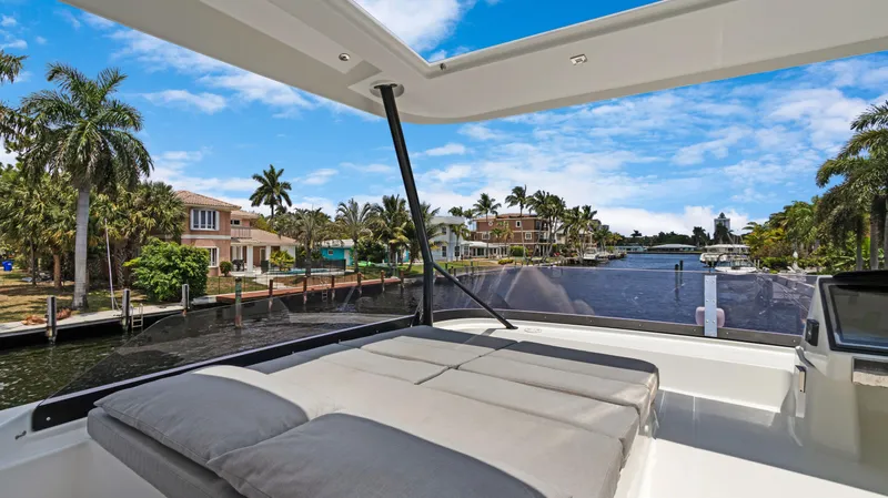 A New Hope Yacht Photos Pics Fountaine Pajot MY 44 yacht, 2018 model, with luxurious deck view of waterfront homes.