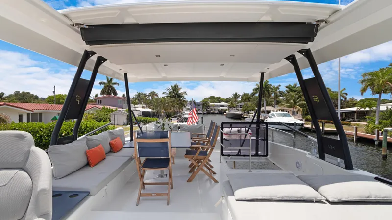 A New Hope Yacht Photos Pics Luxurious 2018 Fountaine Pajot MY 44 yacht with spacious outdoor seating and scenic canal view.