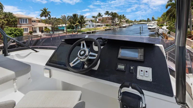 A New Hope Yacht Photos Pics Fountaine Pajot MY 44 yacht helm, 2018 model, with waterfront view.