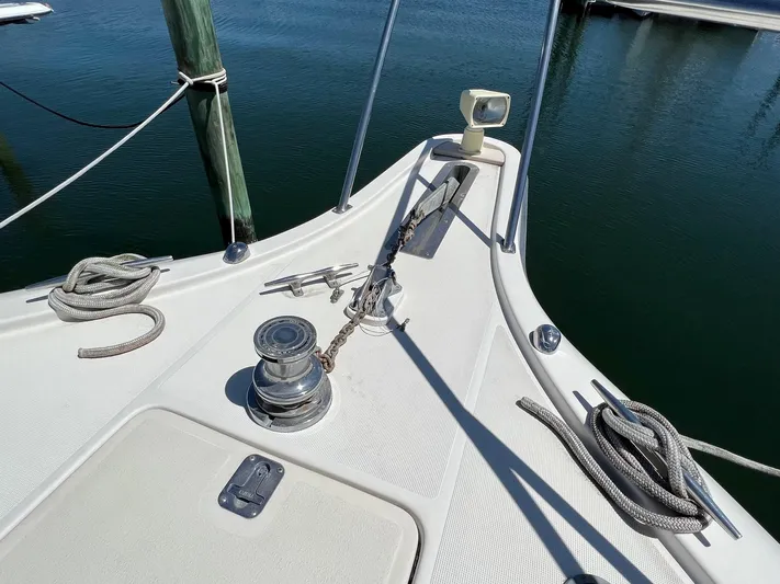 Chaos Yacht Photos Pics Bow of 1996 Tiara Yachts 4300 Open with anchor and ropes.