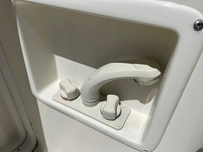 Chaos Yacht Photos Pics White faucet and knobs on a 1996 Tiara Yachts 4300 Open.