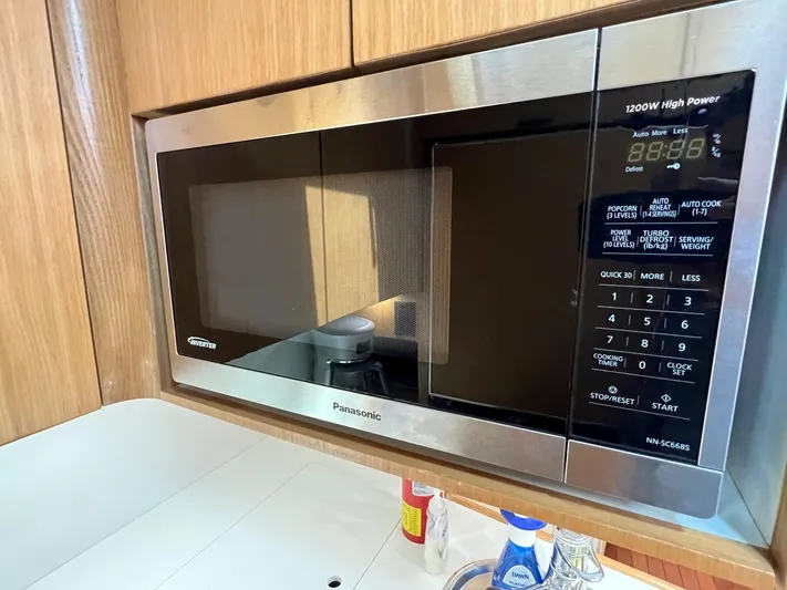 Chaos Yacht Photos Pics Built-in Panasonic microwave in 1996 Tiara Yachts 4300 Open kitchen area.