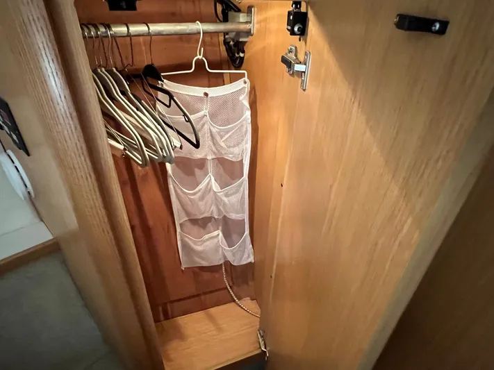 Chaos Yacht Photos Pics Closet with hangers and organizer on Tiara Yachts 4300 Open, 1996 model.