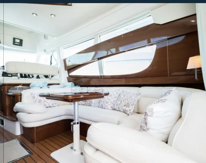  Yacht Photos Pics Luxurious interior of 2003 Jeanneau Prestige 46 yacht with elegant seating and wooden accents.