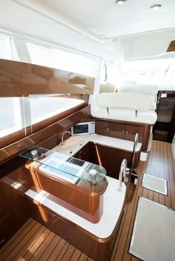  Yacht Photos Pics Interior of 2003 Jeanneau Prestige 46 yacht with modern kitchen and seating area.