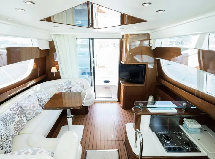  Yacht Photos Pics Luxurious interior of 2003 Jeanneau Prestige 46 yacht with elegant seating and modern amenities.
