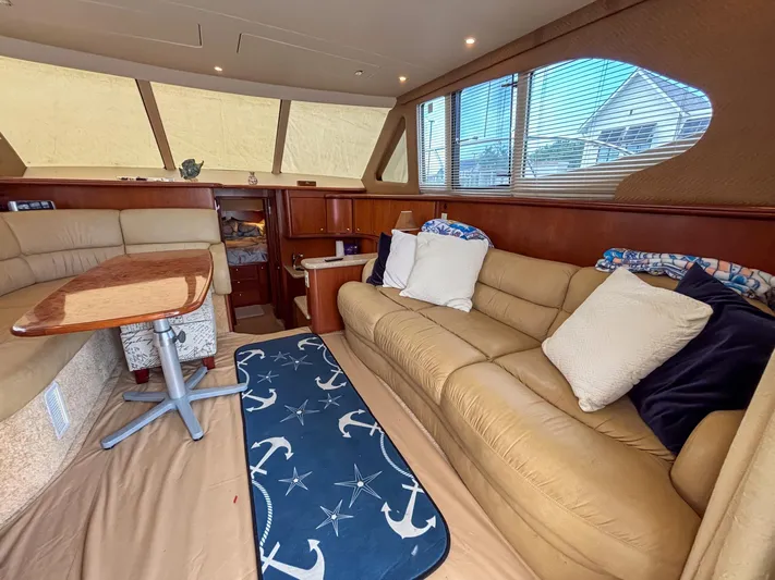 Sea Marie Yacht Photos Pics Luxurious interior of 2007 Silverton 38 Convertible yacht with plush seating and nautical decor.