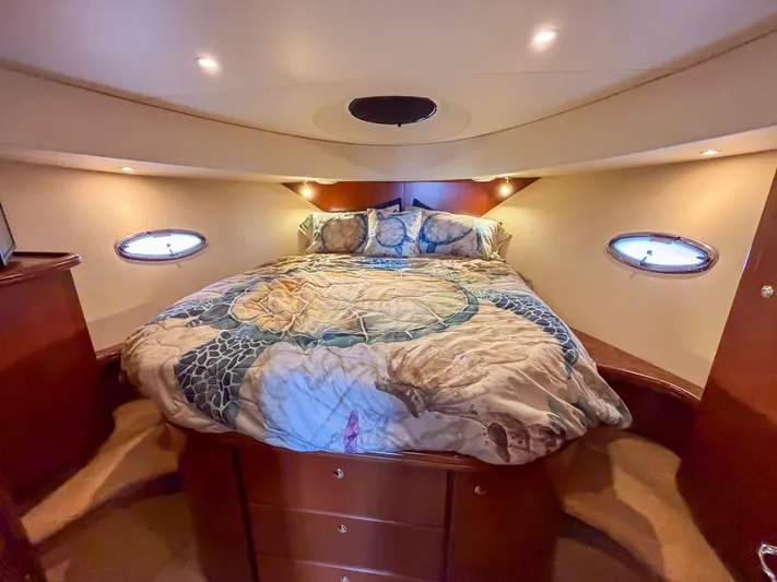 Sea Marie Yacht Photos Pics Luxurious cabin interior of 2007 Silverton 38 Convertible yacht with cozy bed and ambient lighting.