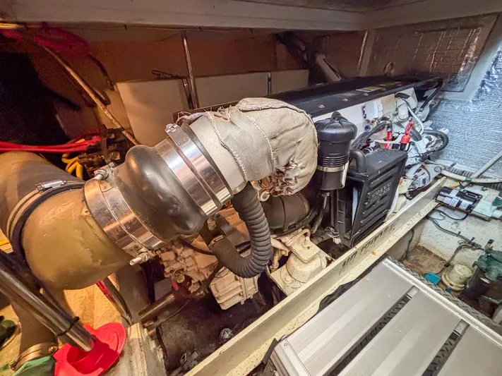 Sea Marie Yacht Photos Pics Engine room of 2007 Silverton 38 Convertible boat, showcasing mechanical components and wiring.