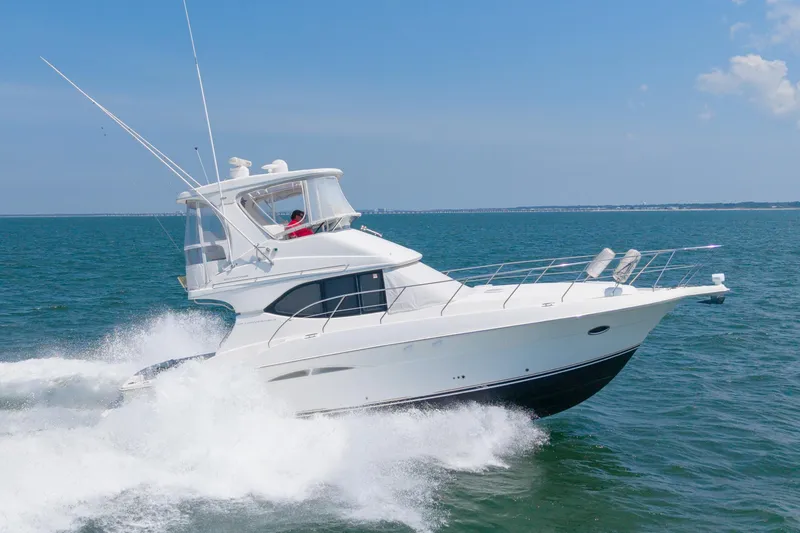 Sea Marie Yacht Photos Pics 2007 Silverton 38 Convertible yacht cruising on open water.