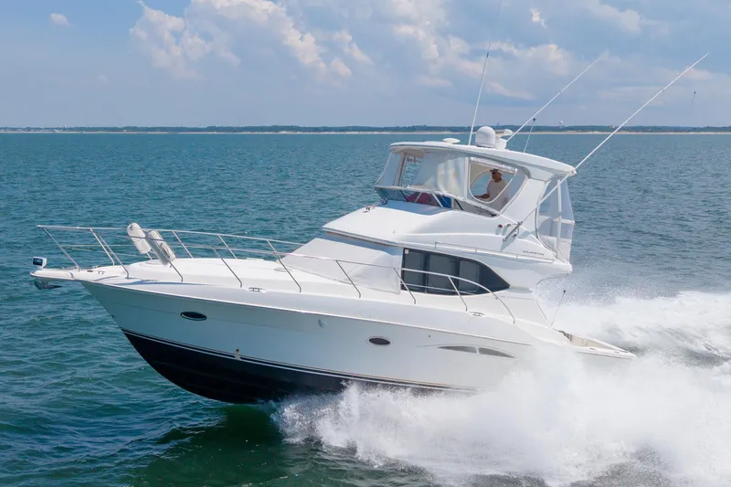 Sea Marie Yacht Photos Pics 2007 Silverton 38 Convertible yacht cruising on open water under a clear sky.