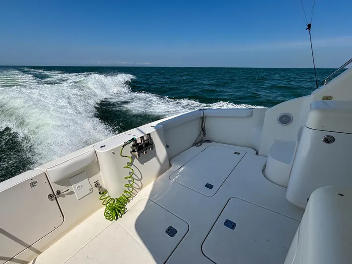 Sea Marie Yacht Photos Pics 2007 Silverton 38 Convertible boat deck with ocean view and clear blue sky.