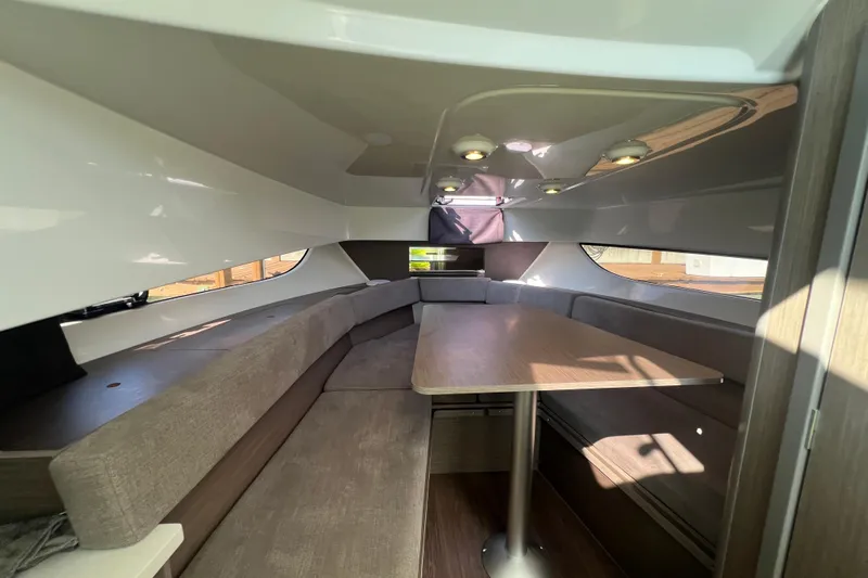 Yacht Photos Pics 2024 Beneteau Flyer 9 SUNdeck interior with seating and table, modern design.