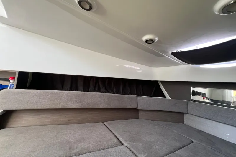  Yacht Photos Pics 2024 Beneteau Flyer 9 SUNdeck interior cabin with modern seating and sleek design.