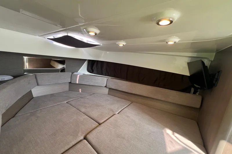  Yacht Photos Pics 2024 Beneteau Flyer 9 SUNdeck cabin interior with cozy seating and modern lighting.