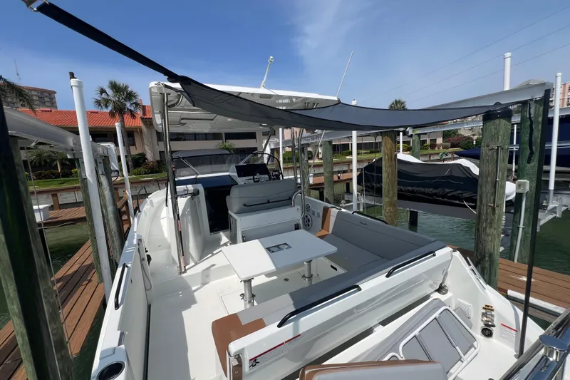  Yacht Photos Pics 2024 Beneteau Flyer 9 SUNdeck boat docked, featuring spacious seating and modern design.
